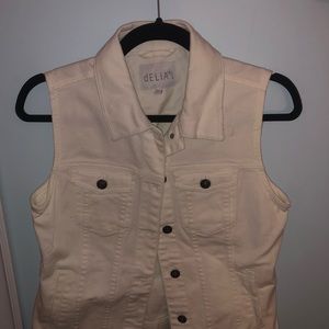 White sleeveless jean jacked